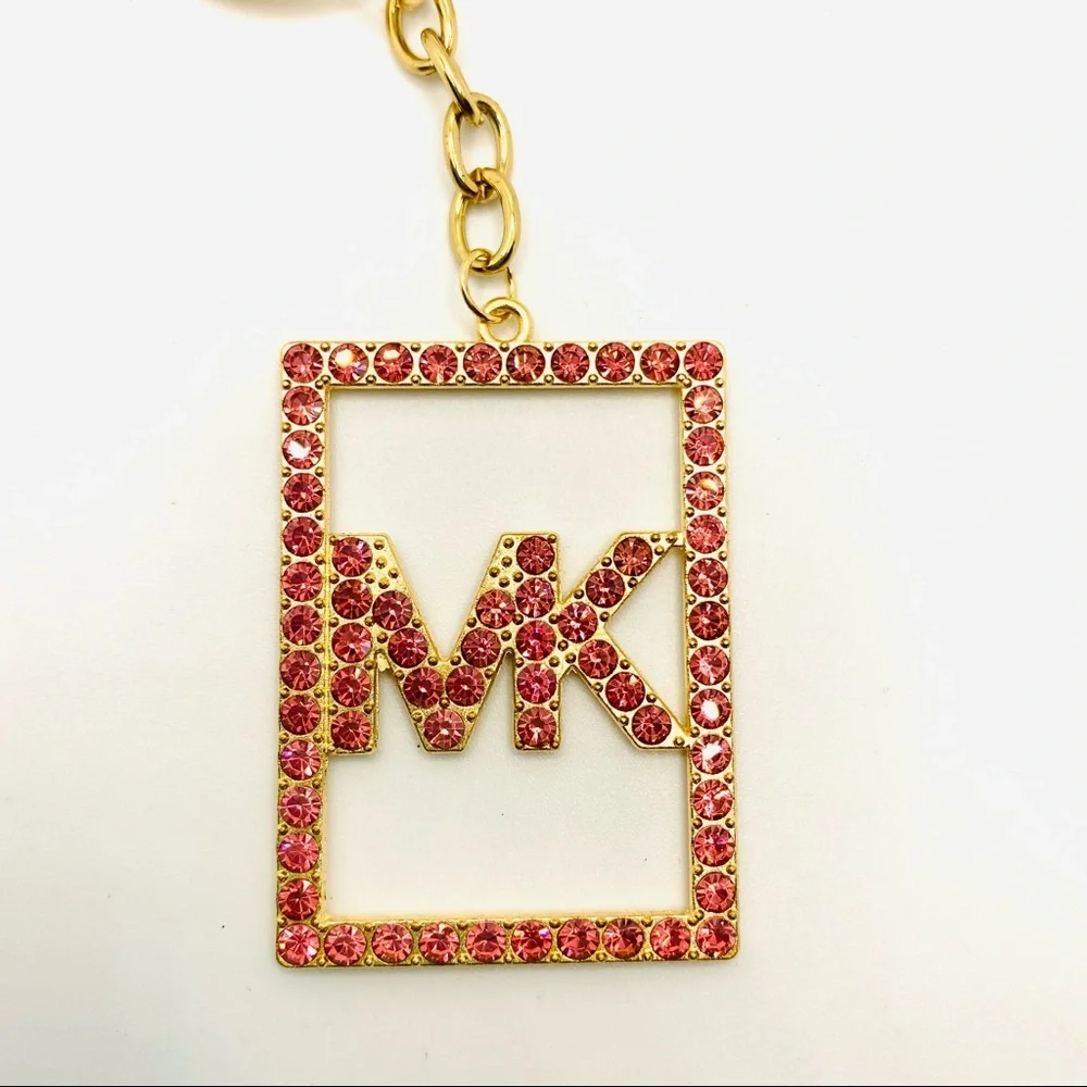 Purse Charm Key Chain MK Pink Crystals set in golden tone. BRAND NEW
